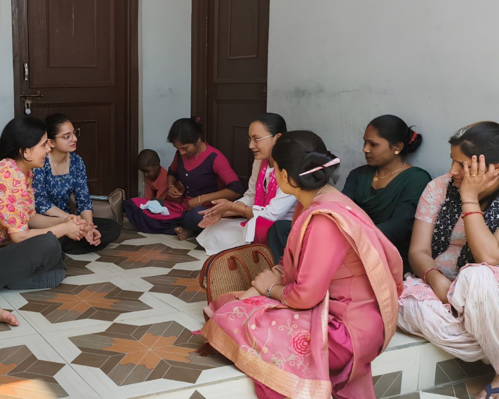EIF leadership conducting a Civic and Governance Lab discussion with rural women in Sidhbari village, Dharamshala.