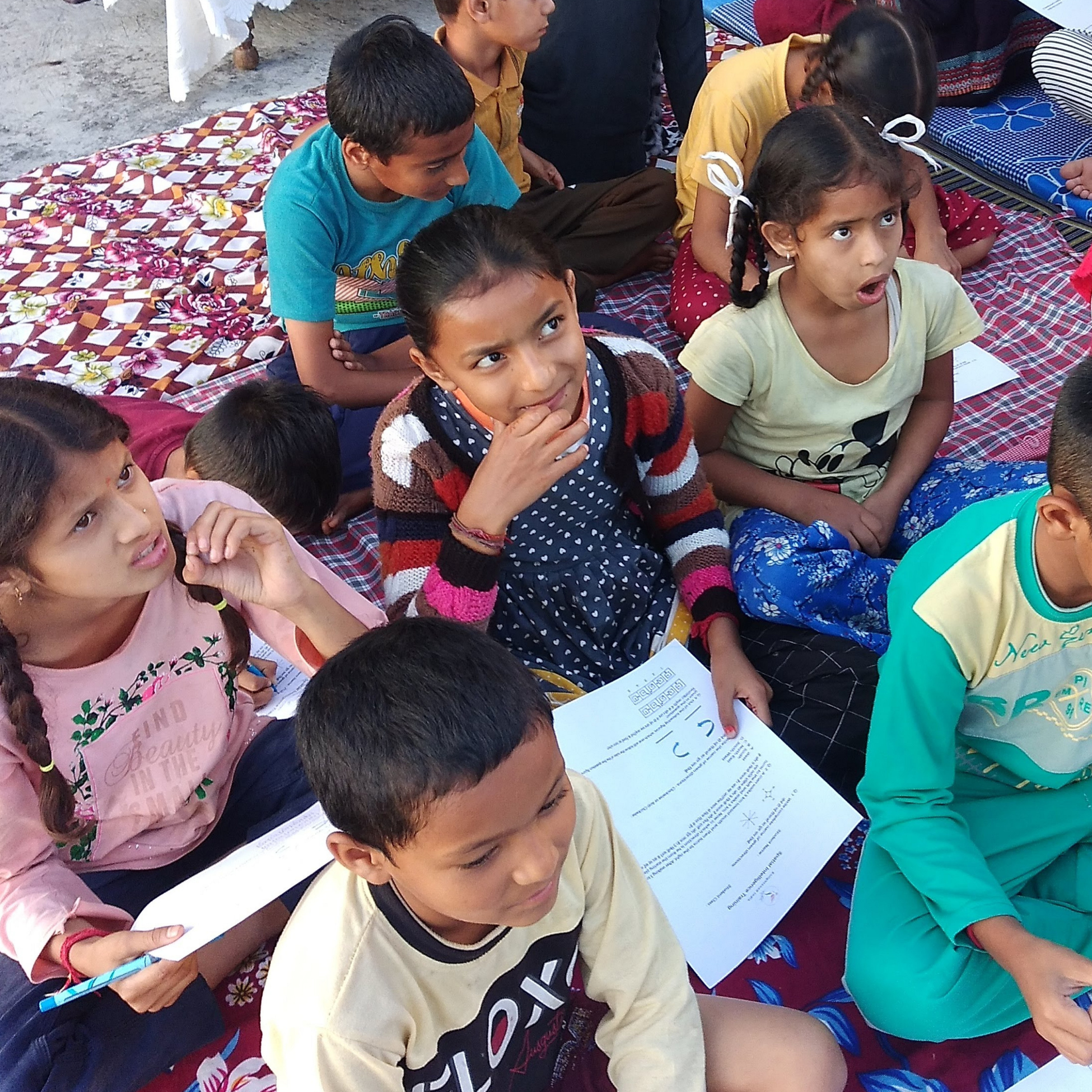 Children from Mohli village, Dharamshala, actively engaged in a critical thinking development session as part of the EIF Adaptive Skills Framework.