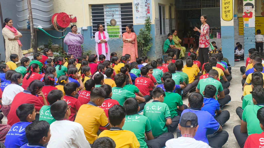 EIF project coordinator leading a practical digital safety and awareness session for students at a private school in Palampur.