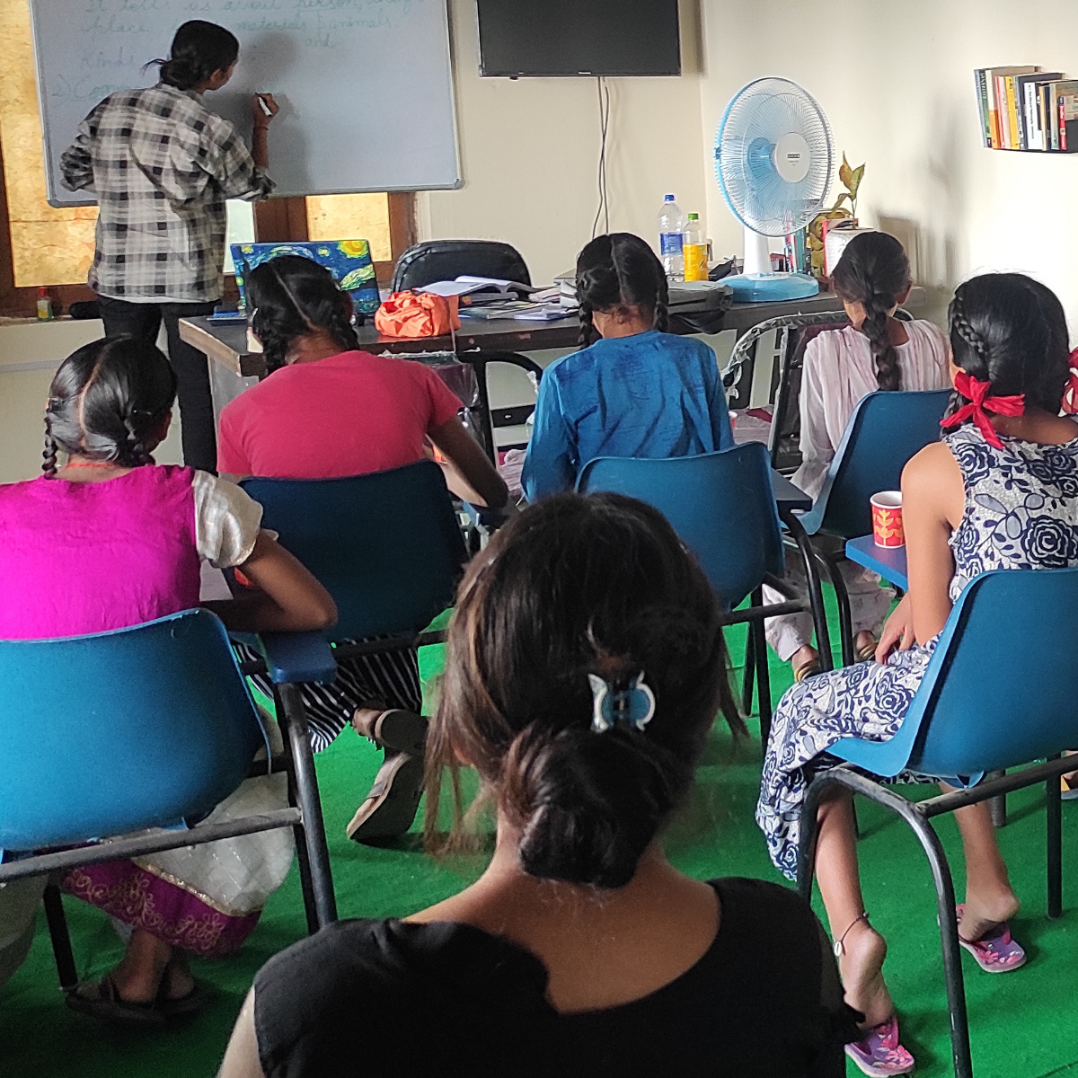 EIF project coordinator leading a leadership and capacity-building workshop for young rural female community leaders at the Slate Godam village training hub.