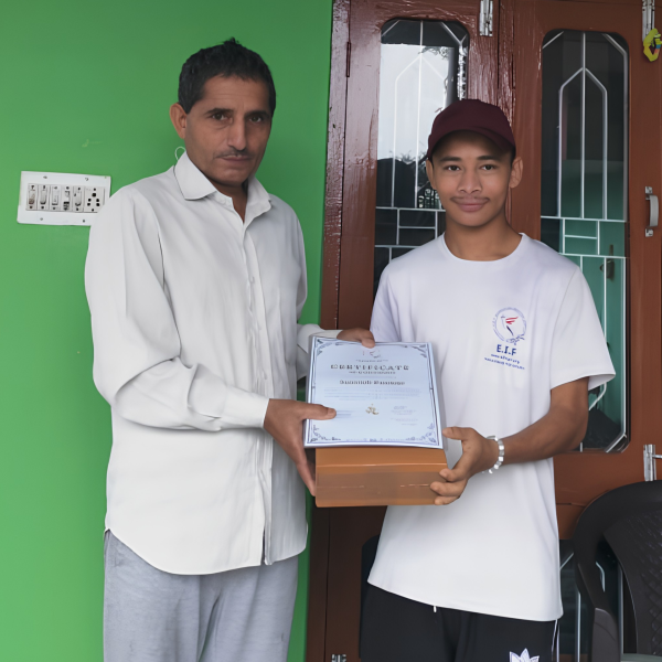 Sarpanch of Sokhni Da Kot Village distributing certificate and prize to EIF boxing camp participants